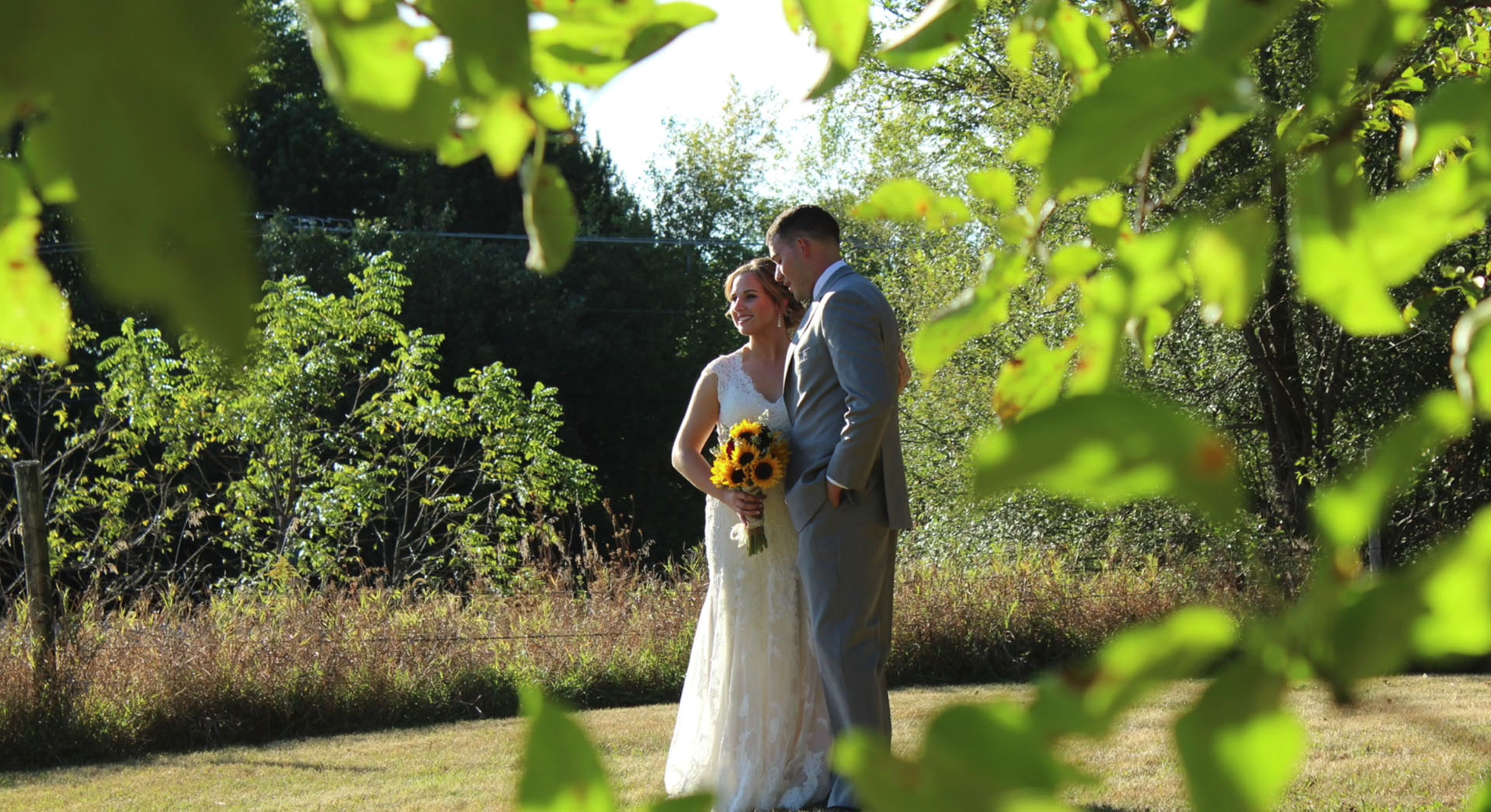 Bride and Groom near the edgeof the woods, farmland at the Barn 1893, Hampshire, IL